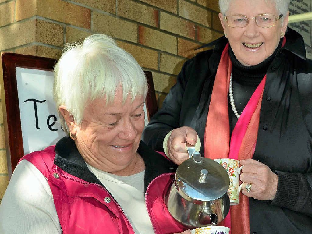 BIGGEST MORNING TEA: QCWA Condamine Valley-Warwick secretary Penny Campbell-Wilson pours international convener Michele Slater a hot cup of tea.